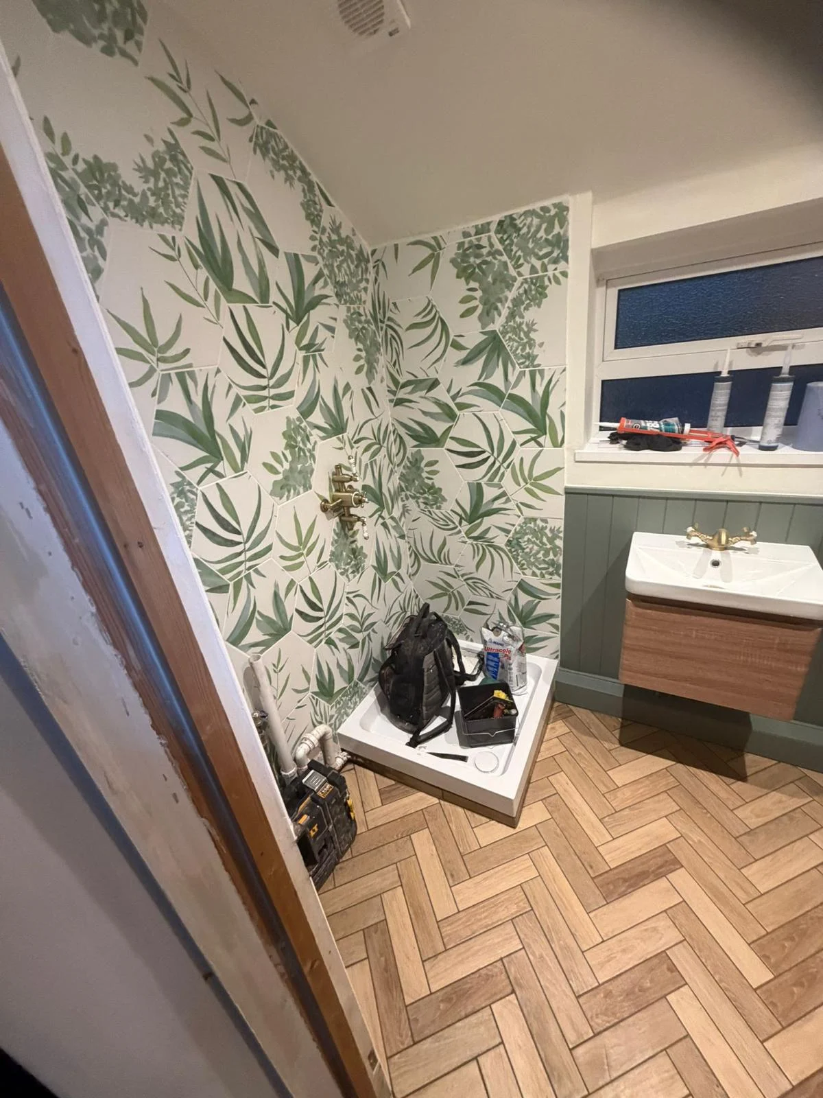 Botanical wallpaper and painted panelling above a herringbone floor — RV Renovation, Oxford